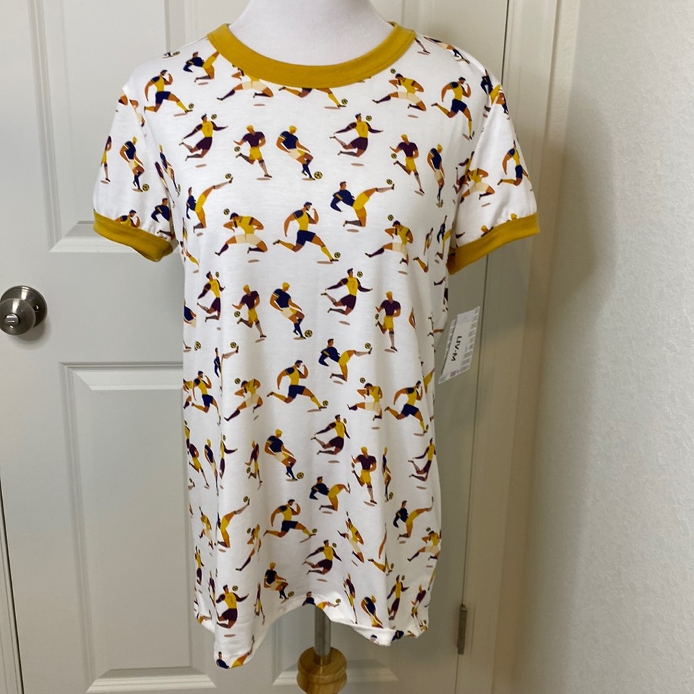 NWT LuLaRoe Liv Tee Medium 10-12 Soccer Player Print Ivory Gold Ringer Shirt